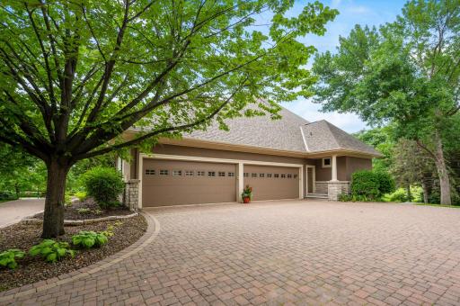 4 stall garage with oversized doors, heating, epoxy floors, and lots of storage space!