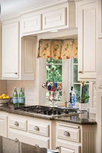 Thermador cooktop with a bay window to the backyard.