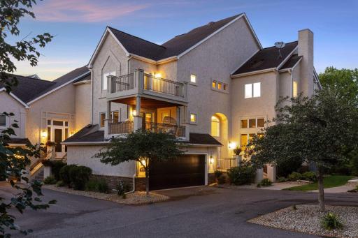 Twilight view of this gorgeous home from driveway