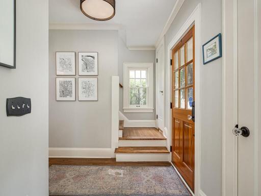 Front entry foyer with two coat closets and newer exterior door.