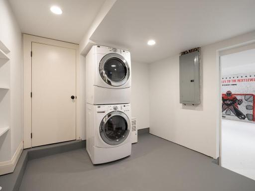 Primary bedroom walk-in closet has a full size washer/dryer and lower level laundry.