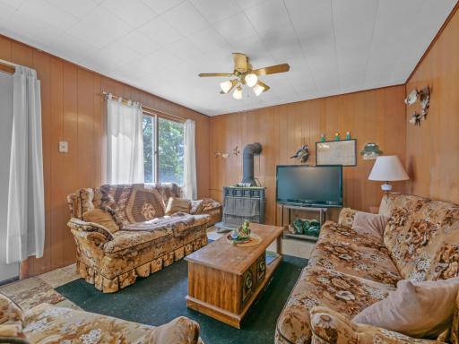 Comfortable Living Room with Wood Burning Stove and Walkout to Patio