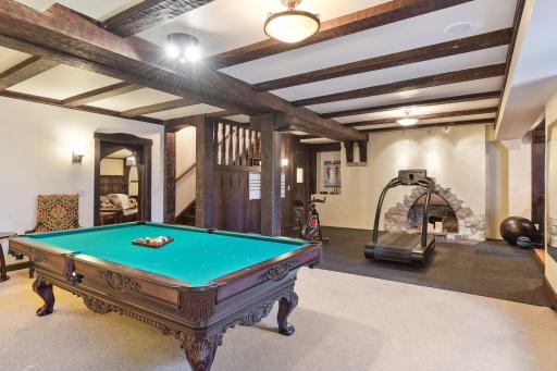 The fun continues in with a pool table, room for gym equipment and a game area.