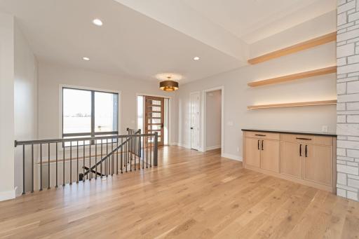 Bright entry and hardwood flooring throughout