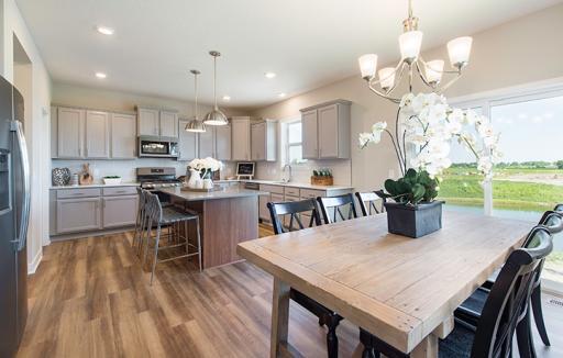 Enjoy plenty of seating at the large kitchen island and dining area adjacent to the kitchen. Perfect for entertaining or enjoying a quite night in with family!