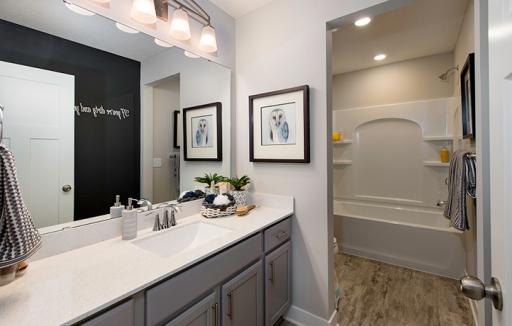 Th spacious upper level bath provides plenty of space for everyone!