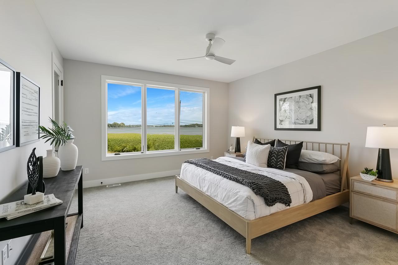 Main level primary suite with lake views
