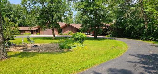 Driveway - Multiple perennial gardens throughout the property.