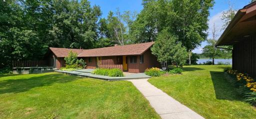 Driveway side of the Guest House with large decks, patio and cement sidewalk.