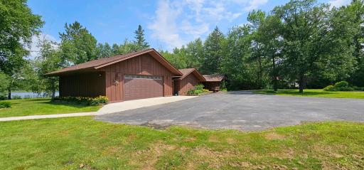 Asphalt circle driveway - view of the main garage and main house.
