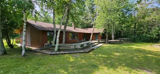 Riverside view of the Guest House - Huge wrap-around deck as well as decks on the driveway side as well.