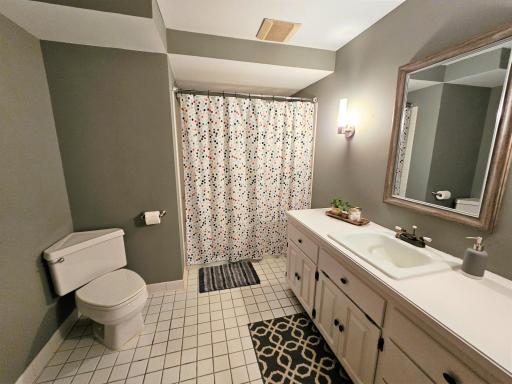The lower bathroom has an extra large vanity and full tub.