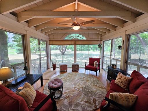 This three-season sunroom provides the perfect place for entertaining, reading a book, or watching kids play in the large back yard.