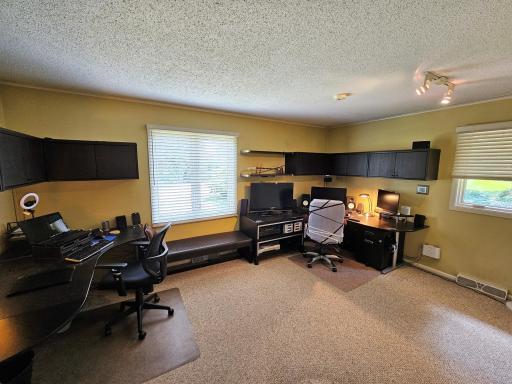 The second bedroom, currently functioning as an office, is spacious and built in storage.