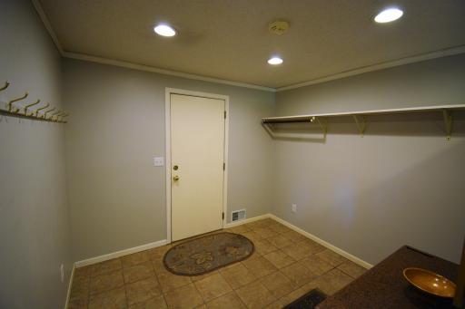 Access from the attached garage and bountiful storage make this a great second entry.