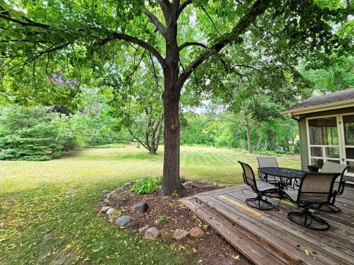 The deck has full wrap-around stairs to allow for easy access to the huge back yard.