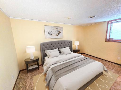 This lower-level bedroom has plush carpeting and a large egress window for lots of daylight.