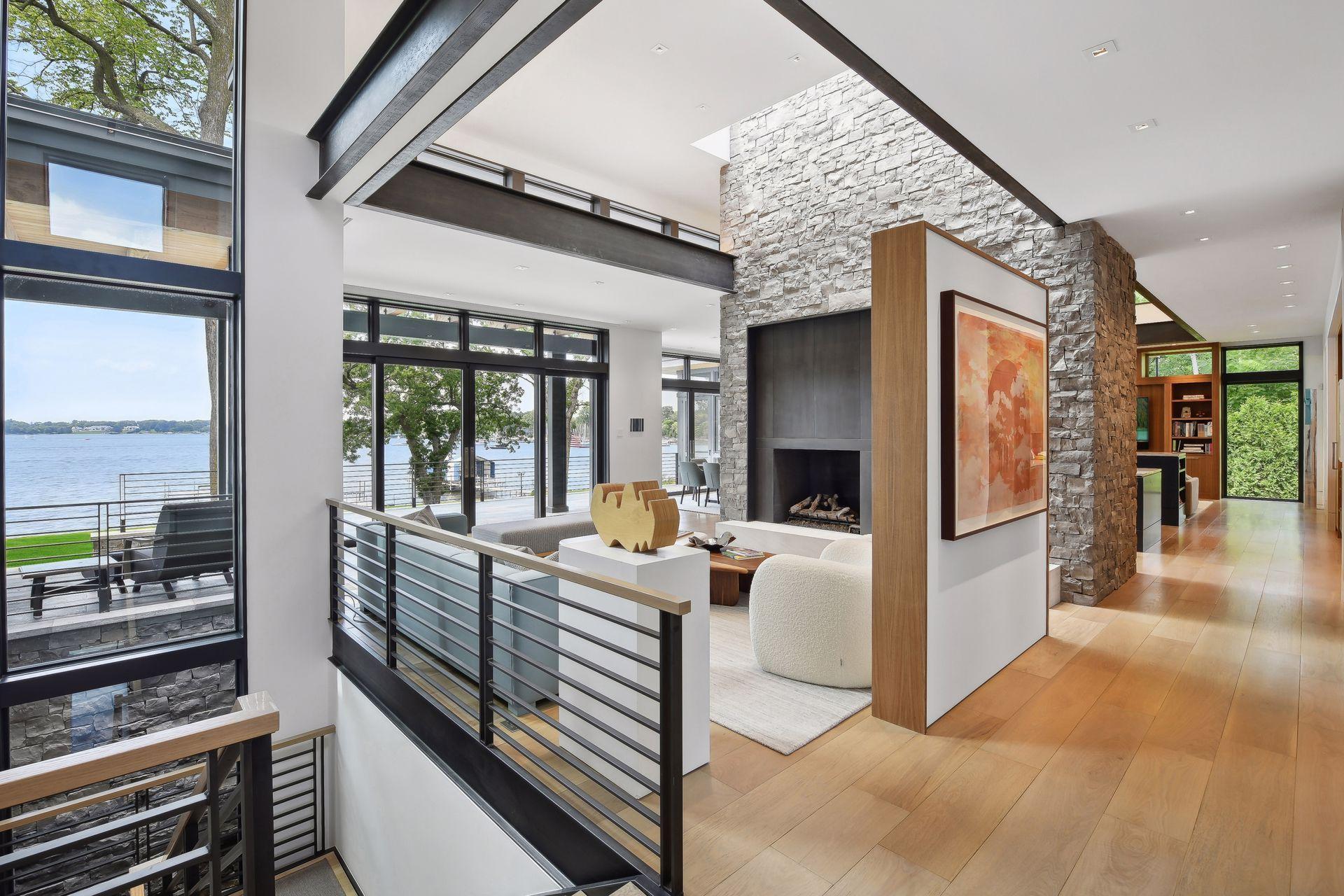 Steel beams and wall of stone create commanding living space