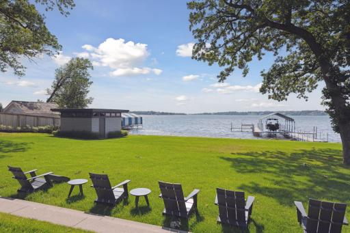 Level yard with 125' of sandy shore and boat house for storage
