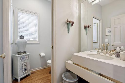 Main floor powder room with double doors for privacy