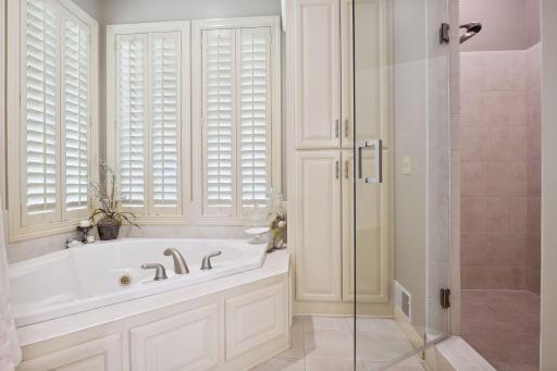 Primary bathroom with full tub and separate shower