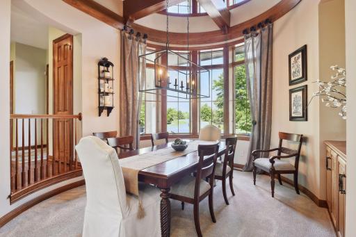 Formal dining room with with custom built circular design and woodwork