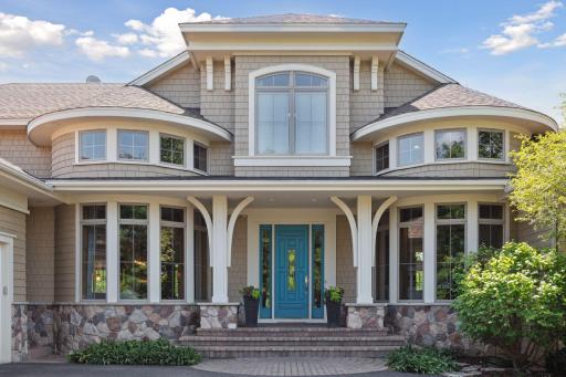 Beautifully designed home with an inviting front porch and top of the line Anderson windows and patio doors