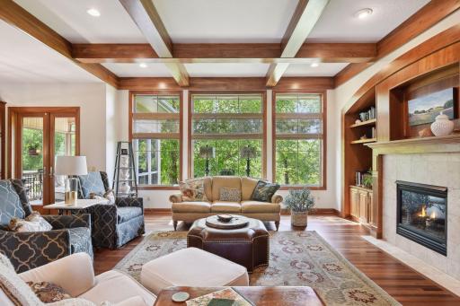 Main floor family room with large window and custom woodwork