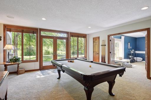 Billiard area with access to outdoors and wet bar