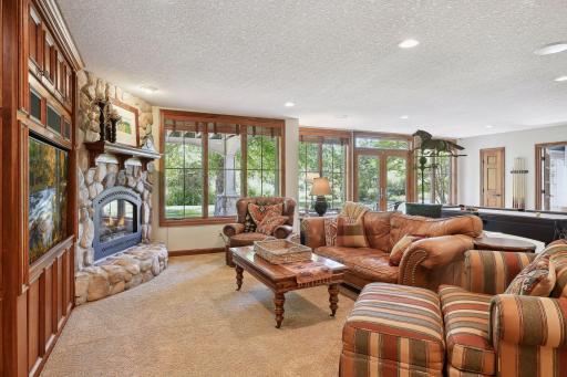 Spacious lower level walkout family room with additional gas fireplace