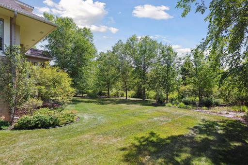 Private backyard with a pond located behind property