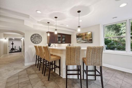 Heated tile floors in the bar keep the basement warm