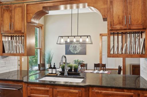 Convenient pass through to casual dining area for serving food and easy clean up after