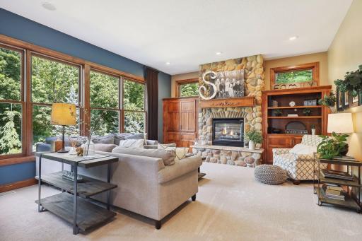 Built ins and beautiful stone gas fireplace