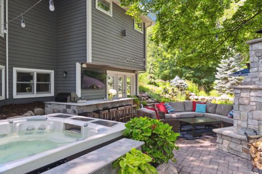 Hot tub is included with the home and built in to the landscaped area