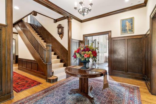 Welcoming and Formal Foyer with Vestibule and Rich Oak Wainscotting