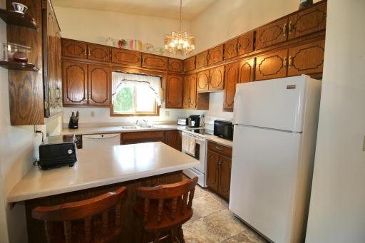 Kitchen with vaulted ceilings and breakfast bar..jpg