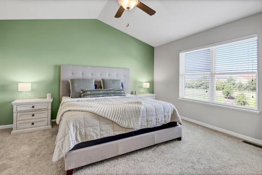 Vast Owner's Suite with great views of backyard pond