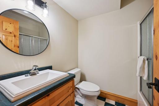 New lighting, fresh paint and new mirrors give the bathroom an updated look.