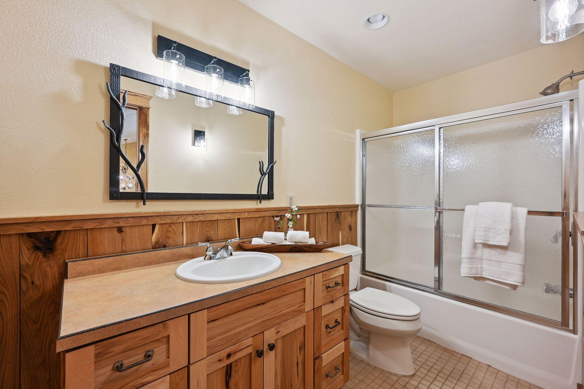 You will notice new paint and lighting in this full bathroom.