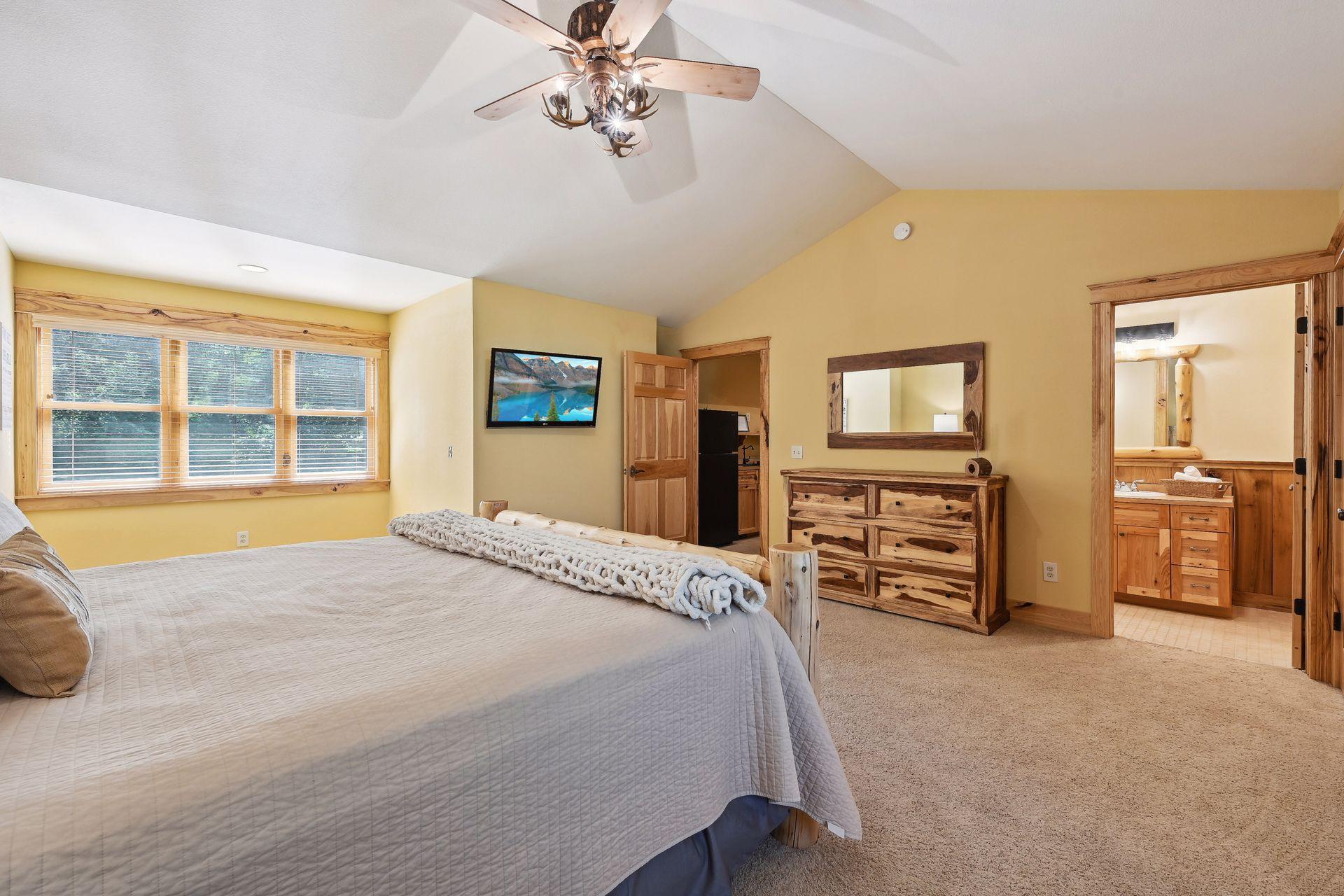 The en suite bathroom has been repainted and features new overhead and sconce lighting.