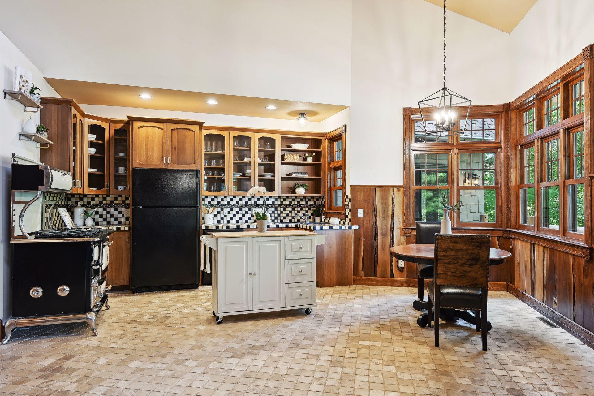 The cozy kitchen has panoramic lake views from every angle.