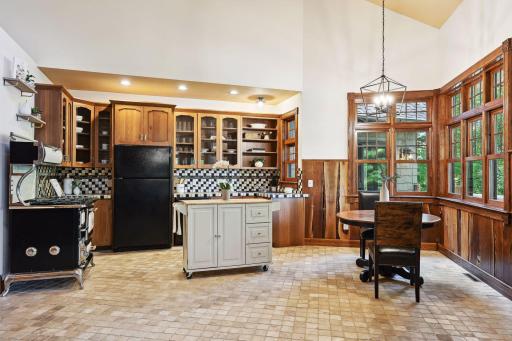 The cozy kitchen has panoramic lake views from every angle.