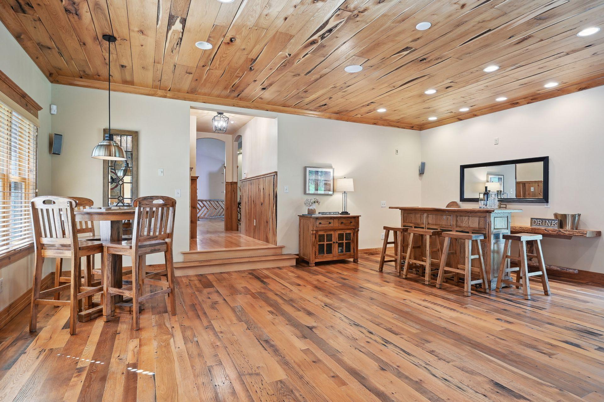 Across the entryway from the owner's suite, you will step into the amazing amusement room complete with a gaming area, bar, and sitting space with a wood burning fireplace.