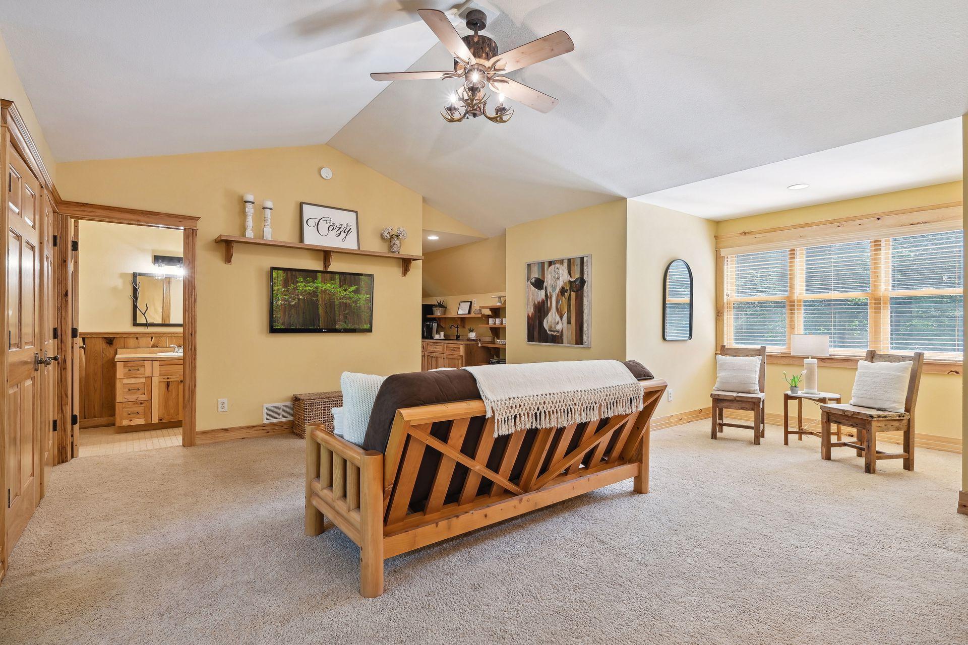 The suite also has a reading nook and attached bathroom. Use this space for overflow sleeping or just relaxing.