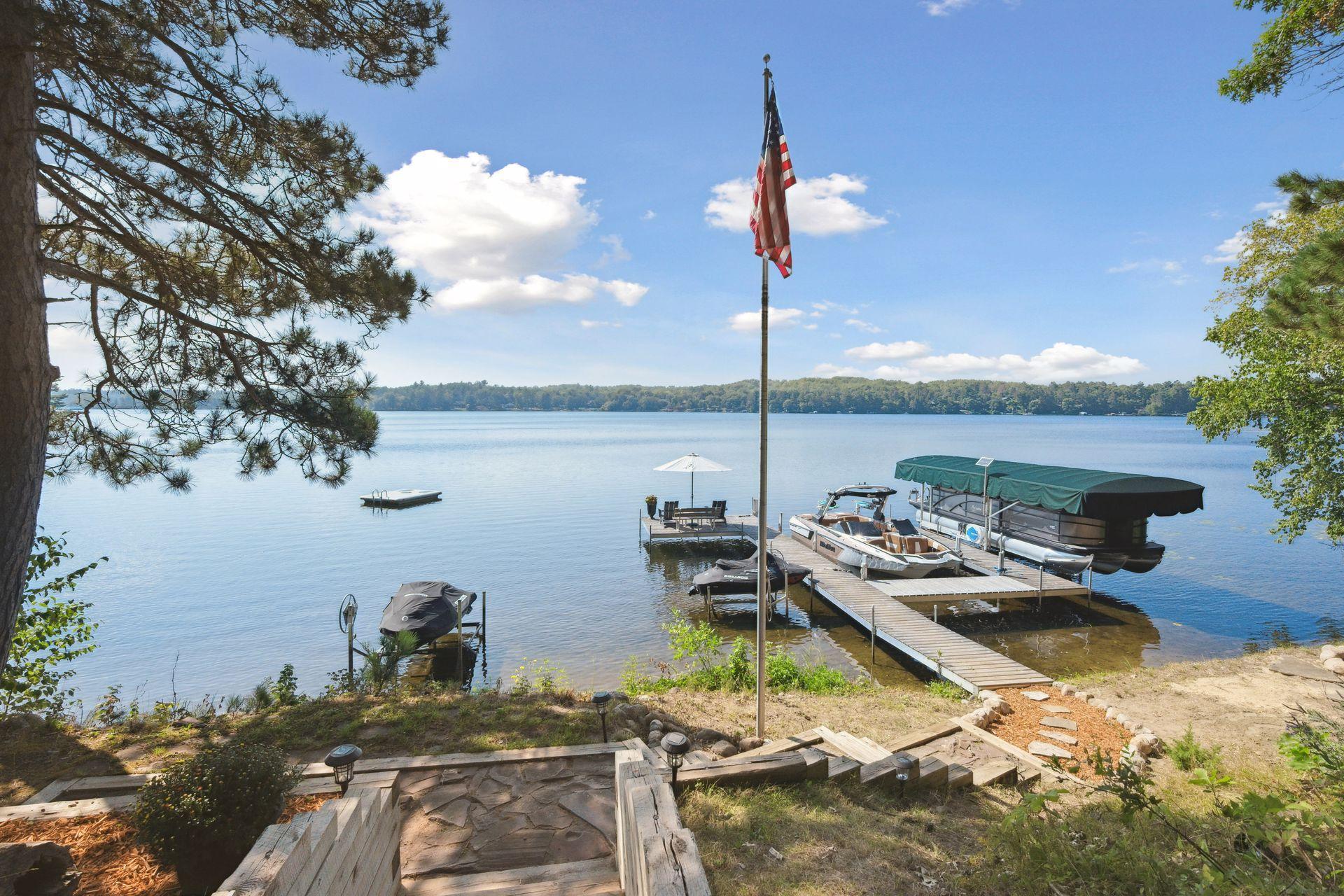 Stone steps lead to the dock and private beach area.