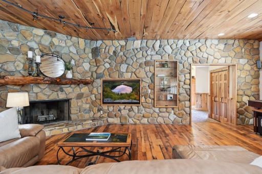 One of four fireplaces throughout the home give this room an extra element of relaxation.