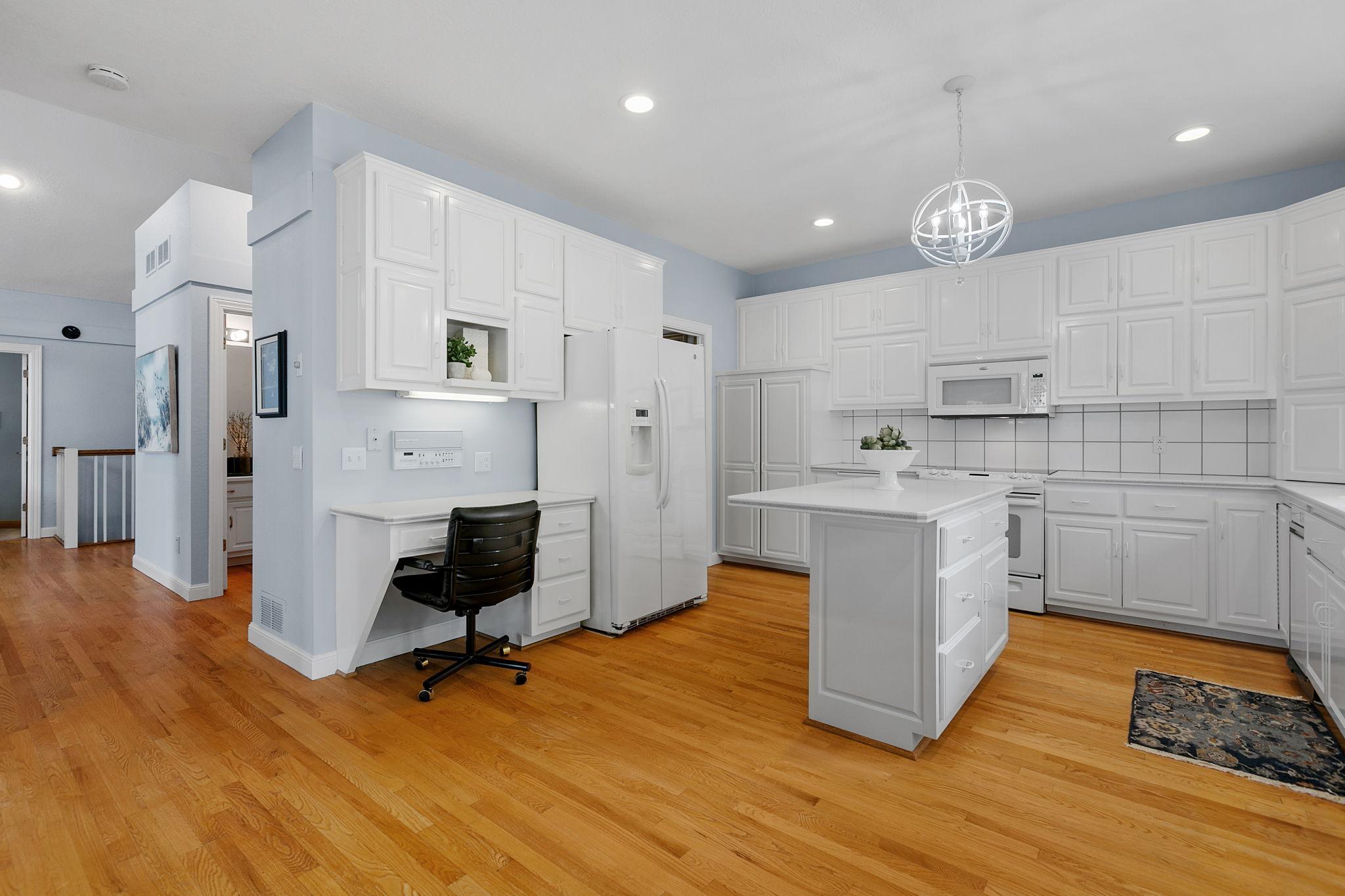 Oak hardwood flooring throughout the Entry, Family Room and Kitchen