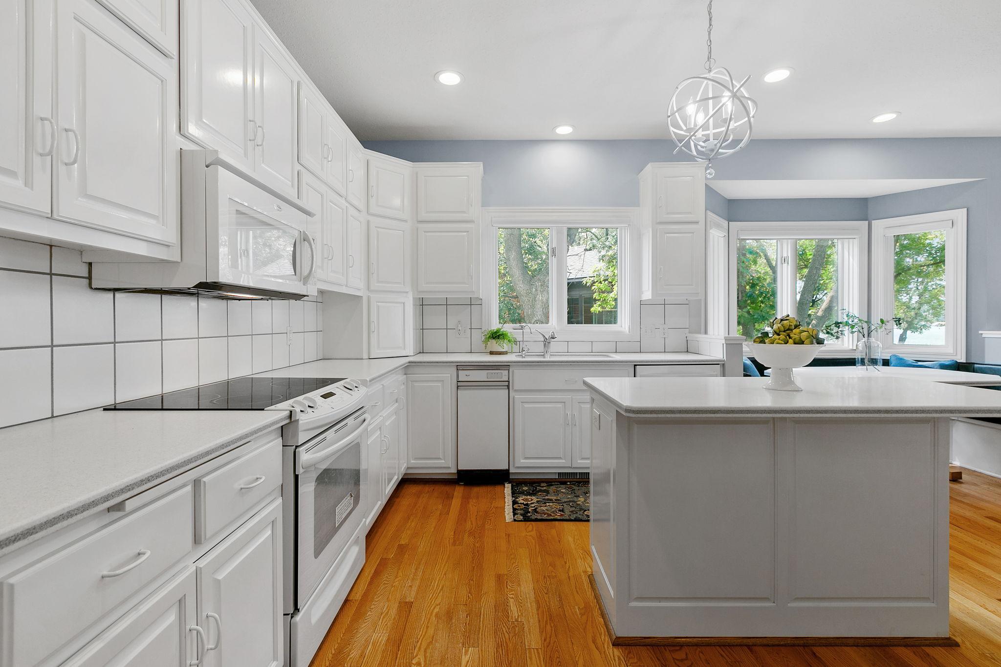 Appliances include refrigerator, electric range, microwave, trash compactor and dishwasher