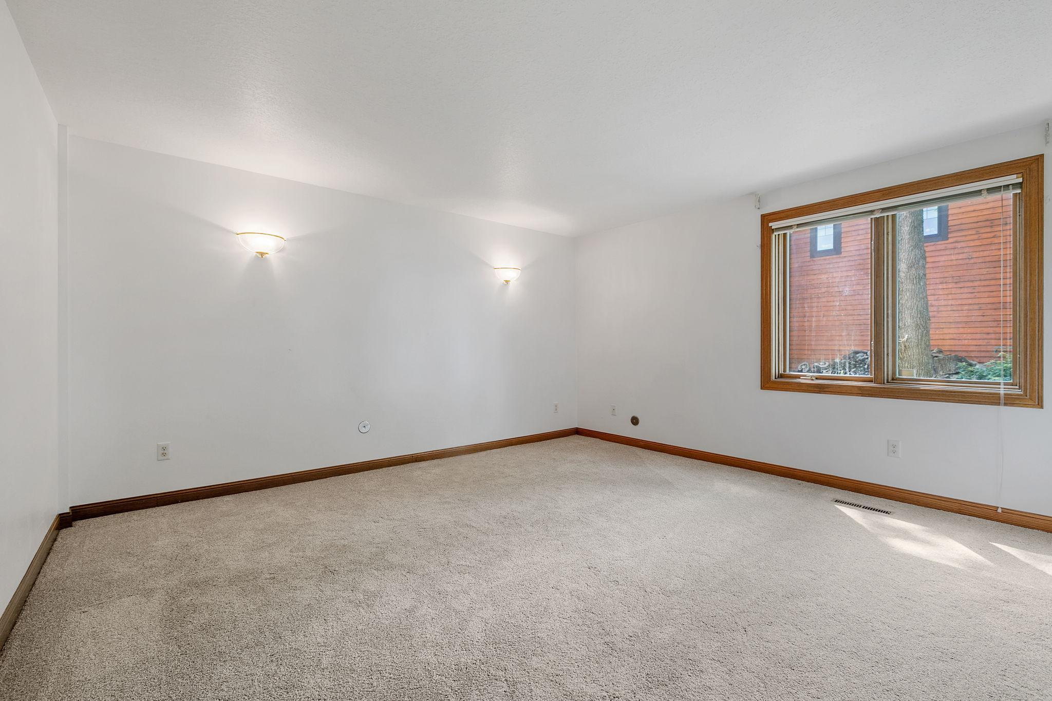 Generously sized 3rd Bedroom includes pair of decorative wall sconces